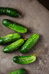 Fresh cucumbers on dark background.