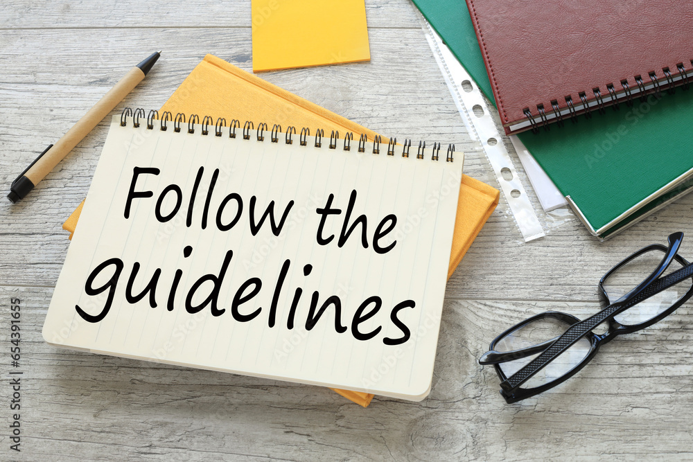 Poster follow the guidelines. work table notepad on yellow notepad. text