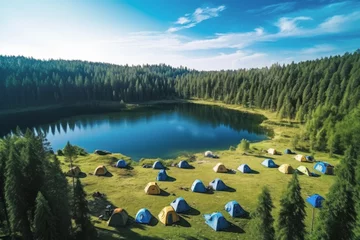 Fotobehang Drone view with landscape and nature of tents camping area at lake in background of summer green forest. outside concept for holidays and travel. © cwa