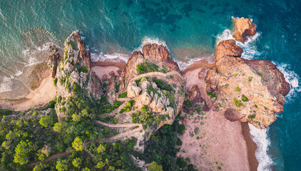 Massif de l'Esterel -Theoule sur Mer -Pointe de l'Aiguille. Esterel Mediterranean coast of red rocks, beach and sea. French Riviera on the Côte d'Azur