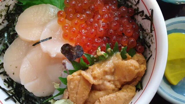 Hokkaido famous raw fresh seafood over rice donburi salmon roe scallop and sea urchin