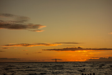 Sunset at Waikiki Beach on the Hawaiian island of Oahu - 654410009