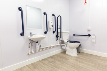 Multipurpose toilet installed in a commercial facility. Warehouse self storage