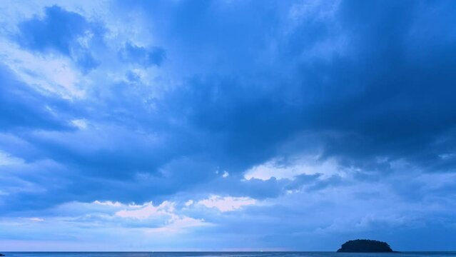 .footage of rain clouds Dark storm clouds over ocean open sea in evening sky sunset or sunrise sky. .Approaching storm clouds at seashore in bad weather day Time lapse.