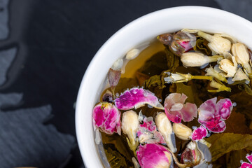 green tea with rose and jasmine flowers