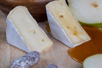 delicious soft cheese with white mold close-up