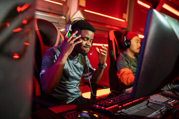 Professional male gaming team participating in a eSport tournament