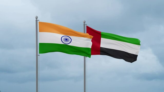 United Arab Emirates and India flag waving together on cloudy sky, endless seamless loop, two country cooperation concept