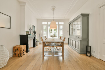 Pendant light hanging over dining table at modern home