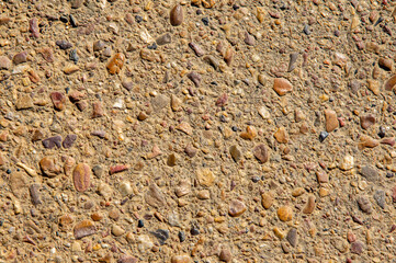 Roadside Textures: Asphalt and Stone Conglomerate.