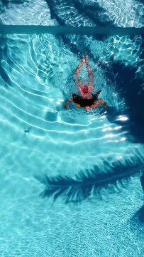 Aerial View of women swimming in swimming pool in Zanzibar