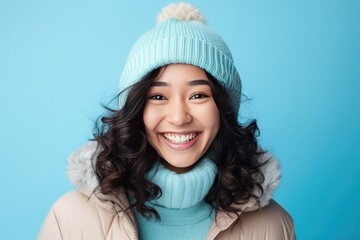 Smiling asian girl in warm winter outfit. Healthy, happy young woman - obrazy, fototapety, plakaty