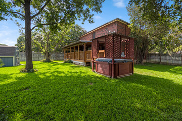 a back yard with a green lawn 