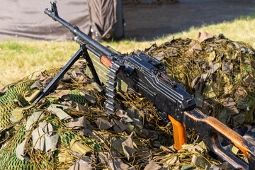 Soviet-made PK machine gun and camouflage netting.. "Kalashnikov's machine gun"