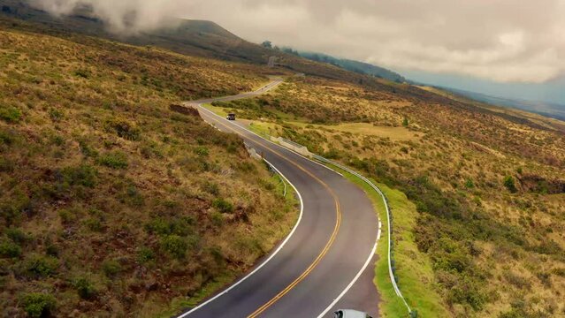 Maui Haleakala mountain winding road cloud cover in the countryside