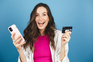 Online shopping. Portrait of smiling brunette curly hair woman paying with plastic credit card on...