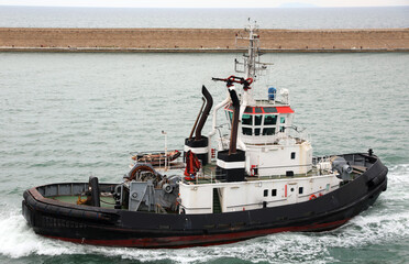 powerful tugboat with reinforced edges To tow cruise ships inside the Port