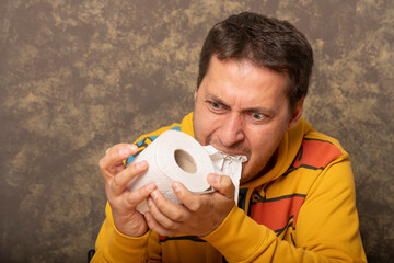 Eating toilet paper by a greedy person. - obrazy, fototapety, plakaty