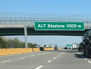 motorways with the text which means you stop at a station one km away in order to pay the motorway toll