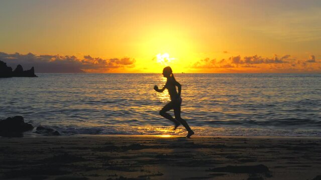 young girl running on the beach