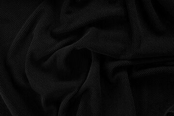 Beautiful waves on black fabric top view