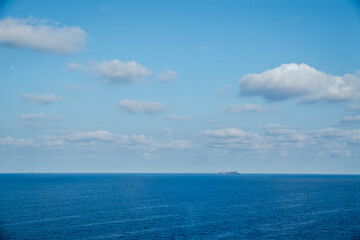 Naklejka na ściany i meble Blue sky with clouds over the horizon Caribbean Sea, the Bahamas