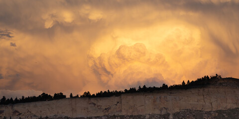 Panorama of Thunderstorm Clouds over Cliffs at Sunset