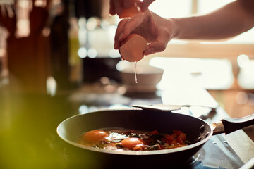 Close up of a young woman preparing a organic meal in the kitchen
