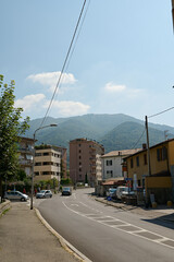 Fototapeta na wymiar Panoramic photography. A road in Italian town in Lombardy