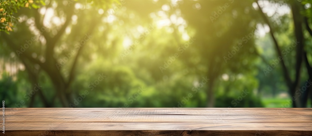 Poster product display template with wooden table and nature background park or garden setting with bokeh l