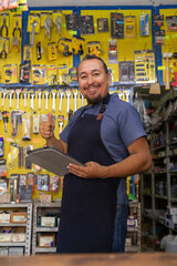 Adult  entrepreneur man with apron in her business,