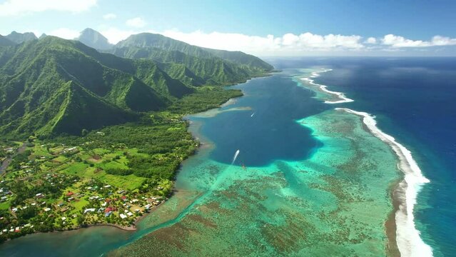 Aerial Tahiti. surfing in Teahupoo. Exotic tropical island, ocean, mountains. Drone  French Polynesia. Teahupoo is a famous surfing destination near Papeete. Adventure travel. 