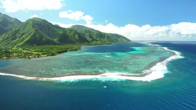 Aerial Tahiti. surfing in Teahupoo. Exotic tropical island, ocean, mountains. Drone  French Polynesia. Teahupoo is a famous surfing destination near Papeete. Adventure travel. 