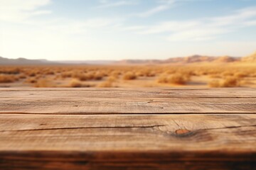 Empty wooden table top with blurred desert background for product display montage