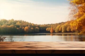 Empty wooden table top with blurred autumn lake background for product display montage