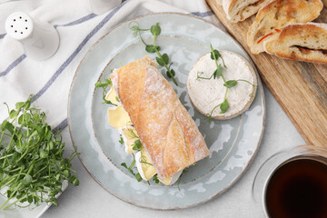 Tasty brie cheese sandwich served on light grey table, flat lay