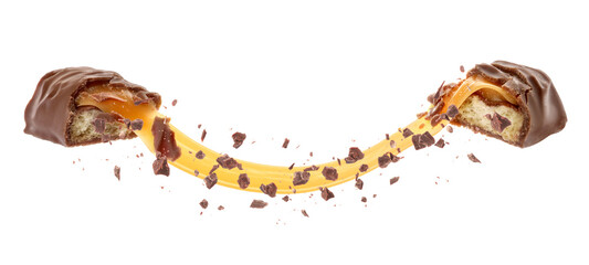 Broken chocolate bar with yummy caramel in air on white background