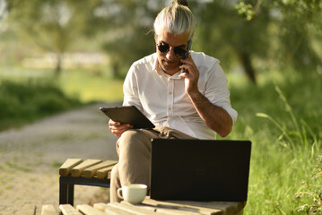 Businessman doing business analysis and evaluation by phone.