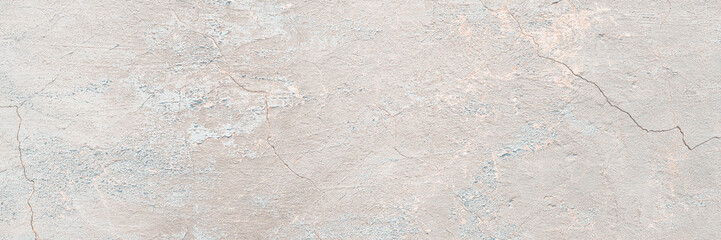 Concrete wall texture with cracked plaster. Weathered uneven rough surface. Perfect for background and grunge design.