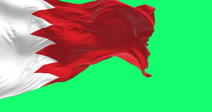 National flag of Bahrain waving isolated on green background.
