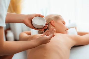 Zelfklevend Fotobehang Masseur hands pouring aroma oil on woman back. Masseuse prepare oil massage procedure for customer at spa salon in luxury resort. Aroma oil body massage therapy concept. Quiescent © Summit Art Creations