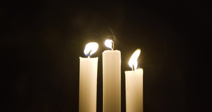 Blowing Candles at night in a room