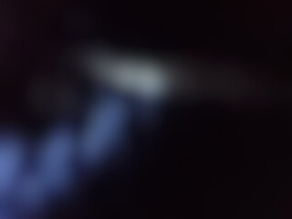 Abstract blur background image of black color gradient used as an illustration. Designing posters or advertisements.