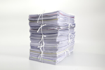 Pile or heap of financial business document paperwork stack on office desk concept of workload...