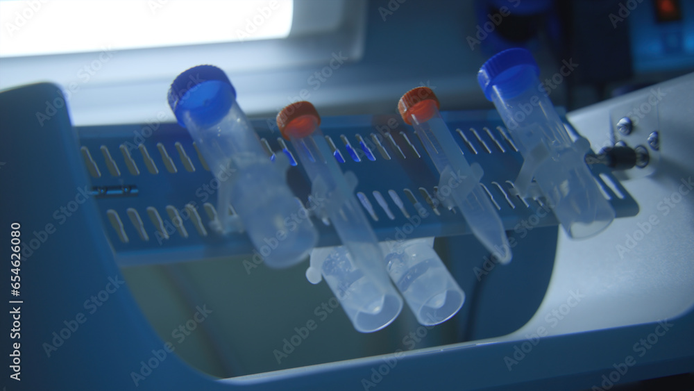 Poster equipment with rotating flasks. stock footage. rotating flasks with tests in laboratory. chemical la