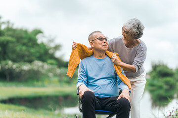 Love and support within an Asian family as they care for their elderly parents, symbolizing values...