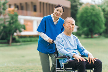Asian people elderly man on wheelchair with caregiver nurse outdoor, , exemplifying the essence of holistic well-being and compassionate support. Nature Therapy