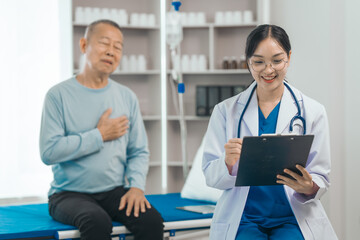 Elderly man engages in thoughtful discussion with compassionate asian people female doctor,...