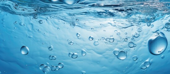 Close up of a clean water surface with droplets from above