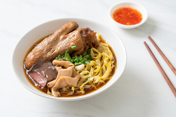 egg noodles with stewed and braised duck in brown soup